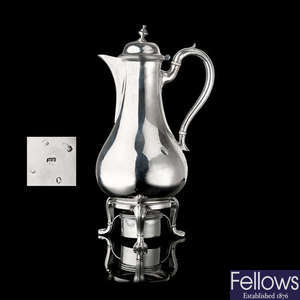 A George III silver coffee pot and lampstand.