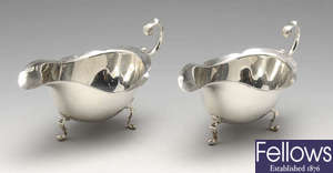 A pair of 1920's silver sauce boats, plus another.