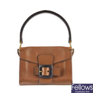 MIU MIU - a brown leather buckle handbag.