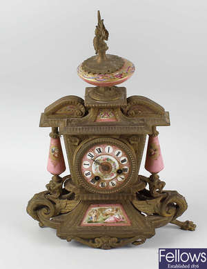 A 19th century French gilt metal and porcelain clock garniture