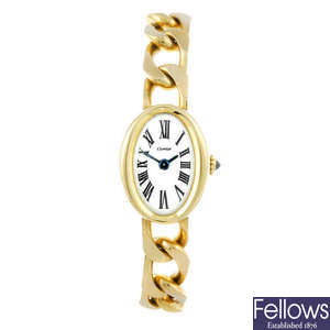 CARTIER - an 18ct yellow gold Baignoire bracelet watch.