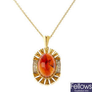 An amber and diamond pendant, with chain.