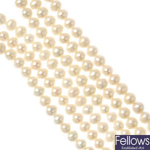 A freshwater cultured pearl necklace and two rings.
