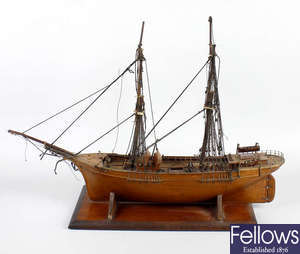 A 19th century carved, well detailed, wooden model of the brig or topsail schooner, 'The Gratitude of Fleetwood'.