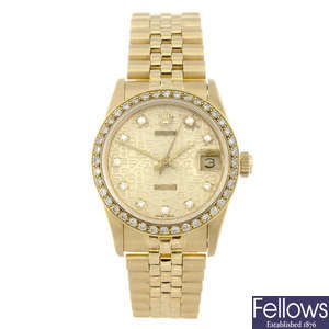 ROLEX - a mid-size 18ct yellow gold Oyster Perpetual Datejust bracelet watch.