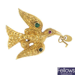 A mid 19th century gold gem-set bird brooch.