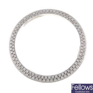 A white metal diamond set bezel in the style of Rolex.