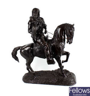 A large modern bronze study of a mounted falconer.