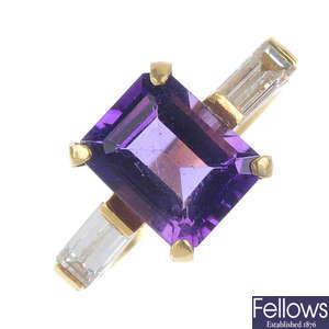An 18ct gold amethyst and diamond three-stone ring.