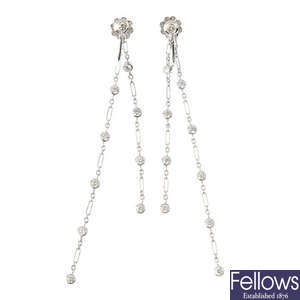 DIOR - a pair of diamond ear pendants.