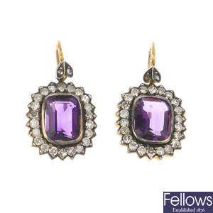 A pair of amethyst and diamond cluster earrings.