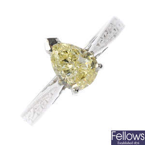An 18ct gold 'fancy light yellow' diamond single-stone ring.
