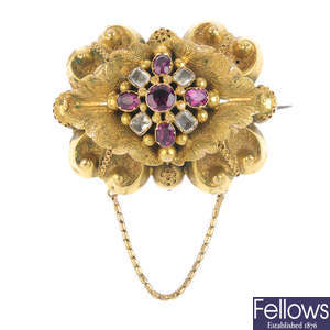 A mid Victorian gold garnet and colourless gem foil-back brooch and ear pendant set, circa 1850.