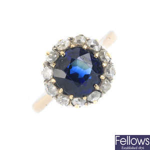 An early 20th century gold synthetic sapphire and diamond cluster ring.