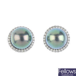 A pair of cultured pearl and diamond cluster ear studs. 