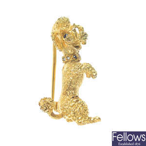 A mid 20th century 9ct gold diamond and sapphire dog brooch.