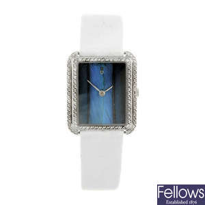 CORUM - a lady's diamond set 18ct white gold wrist watch.