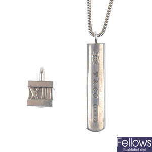 TIFFANY & CO. - a pendant and a padlock charm. 