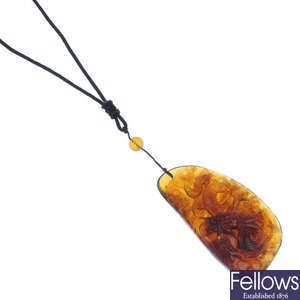A carved Burmese amber dragon pendant.