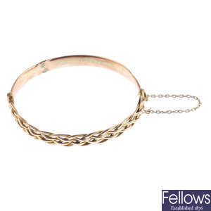 A late Victorian 9ct gold woven hinged bangle.