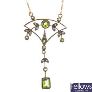 A peridot and diamond pendant, on chain.