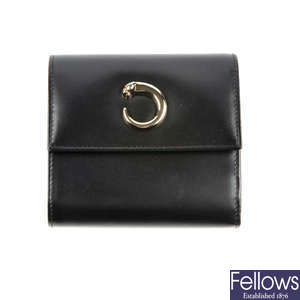 CARTIER - a black leather Panthere compact wallet.