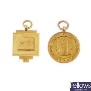 Two early 20th century 9ct gold medallion fobs.