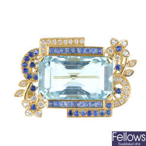 An aquamarine, sapphire and diamond brooch.