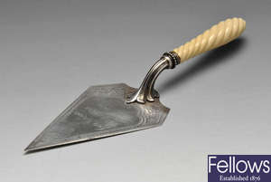 A Victorian silver presentation trowel with ivory handle.
