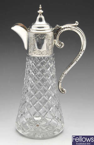 A modern silver mounted cut glass claret jug.