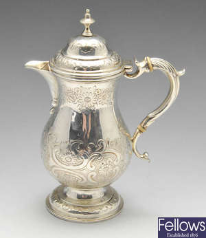 An Arts & Crafts silver coffee pot.
