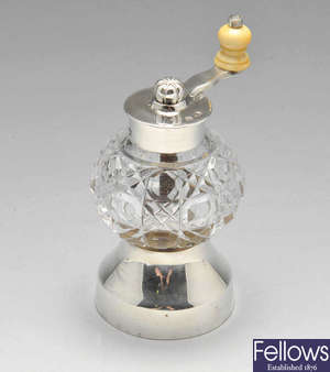 A late Victorian silver mounted and glass pepper grinder.
