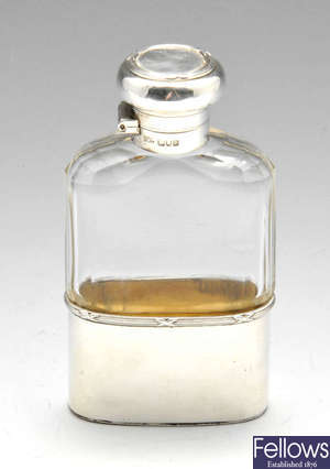 An Edwardian silver mounted small hip flask.