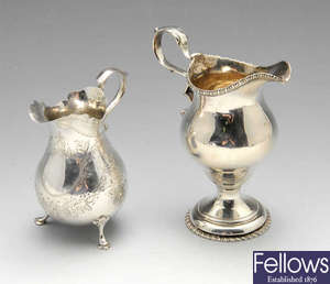 A George III silver cream jug, plus another Victorian example.