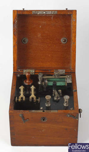 A cased telegraph or morse code machine, by F Darton & Co., London.