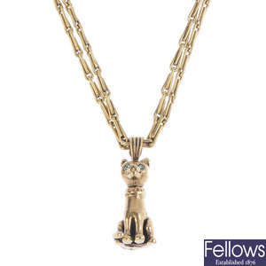 A 9ct gold cat pendant, with chain.
