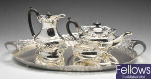 A 1930's four piece silver tea service and tray.