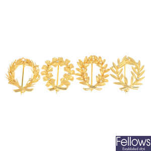 A set of Olympic brooches.