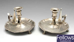 A pair of George III silver chambersticks.