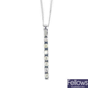 A platinum diamond seven-stone pendant, with chain.