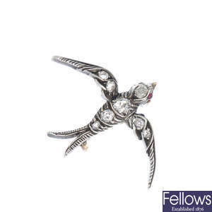 A late Victorian silver and gold, diamond swallow brooch, circa 1890.