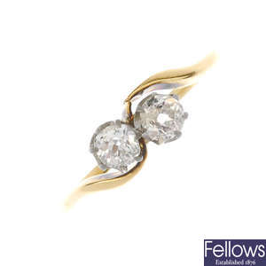 A mid 20th century 18ct gold diamond two-stone ring.
