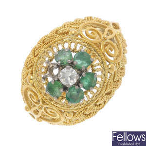 A diamond and emerald cluster ring.