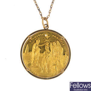 A religious medallion pendant, with chain.