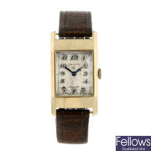 HELVETIA - a gentleman's 9ct yellow gold wrist watch.