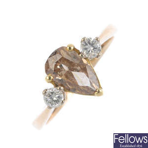 A diamond and 'brown' diamond three-stone ring.