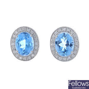 A pair of topaz and diamond cluster earrings.