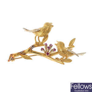 A 1960s 18ct gold and ruby bird brooch.