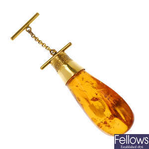 A modified amber pendant drop.