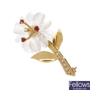 A 9ct gold rock crystal diamond and ruby floral brooch.